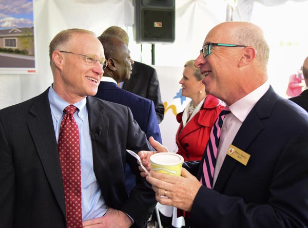 Steve Lipstein, president and chief executive officer of BJC HealthCare, and Creve Coeur Mayor Barry Glantz enjoy some Ted Drewes frozen custard in memory of Evelyn Newman.
